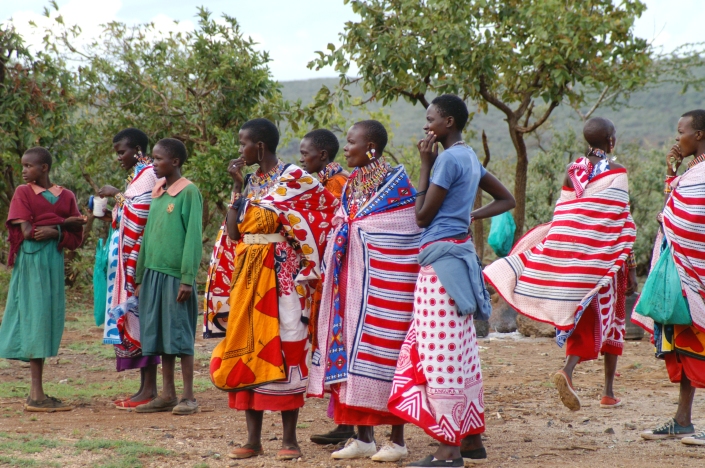 Maasai women and some students at a school event in Olmaroroi